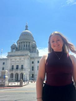 Annie Cooner posing in front of RI State Capitol