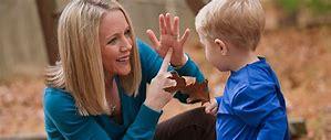Parent and Child practicing ASL