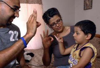 Family practicing ASL